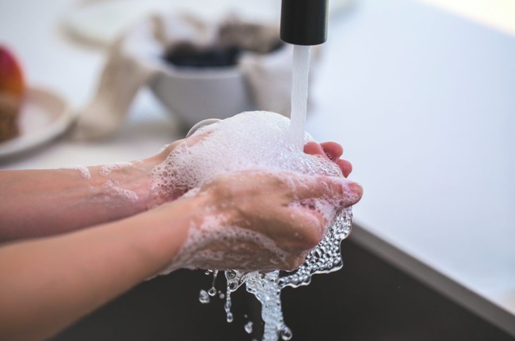 Washing hands in sink