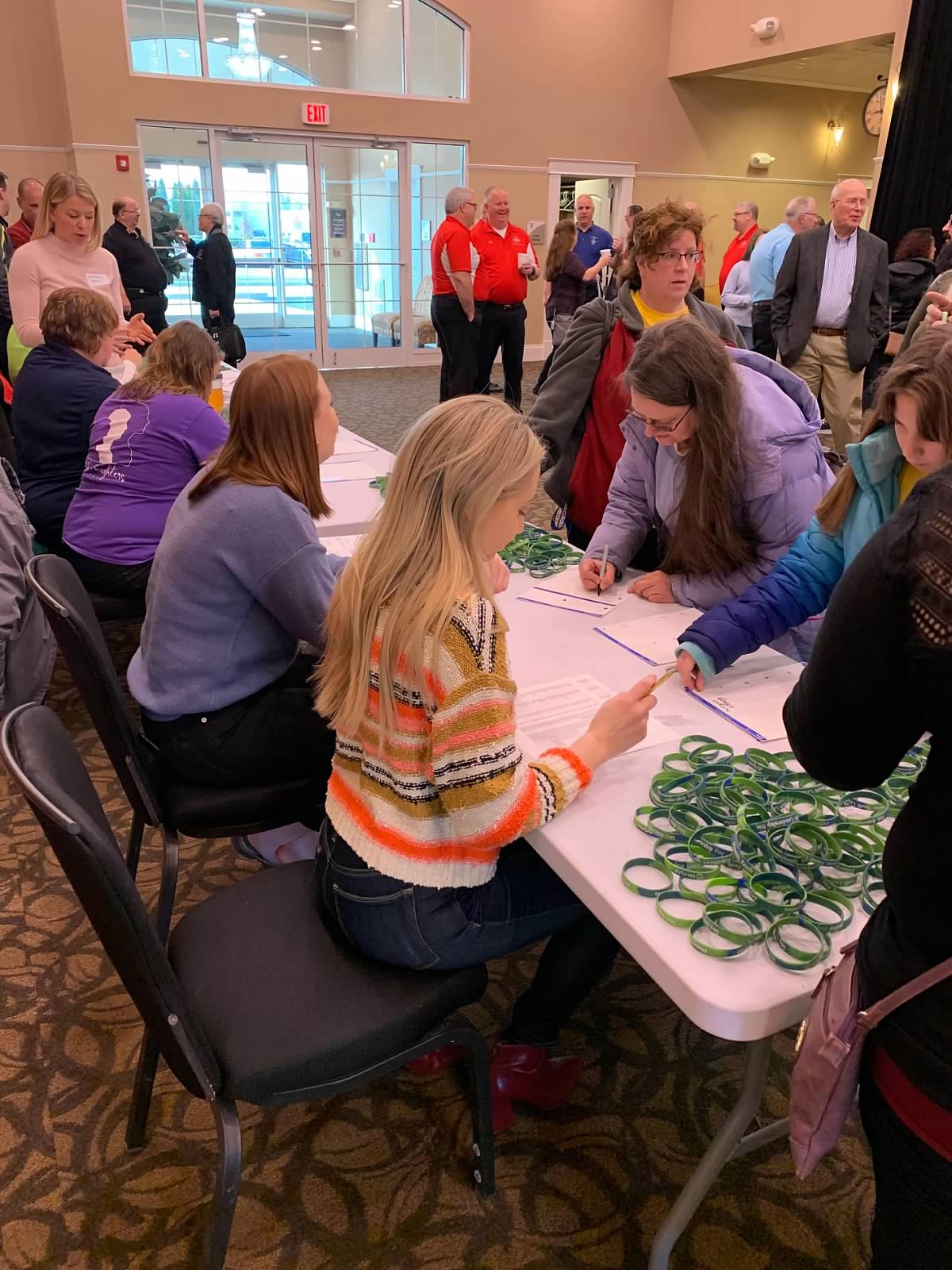 People gathering and signing up for the MMSAP Workshop