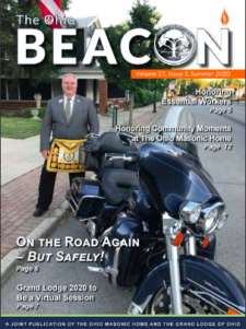 GM Newton poses with his motorcycle on the cover of the Ohio Beacon, Summer 2020 issue