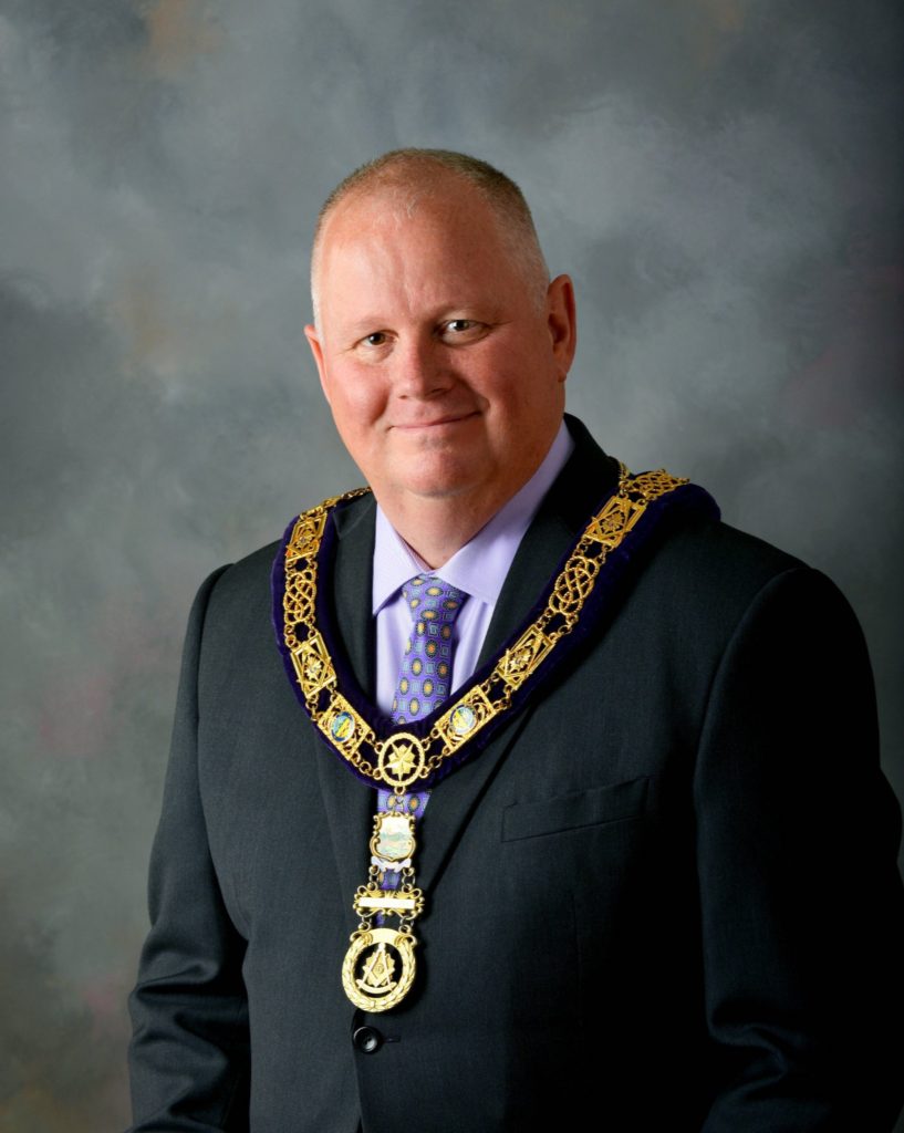 Ohio Grand Master Richard A. Dickersheid official portrait while wearing a coat, tie, and Masonic Jewels