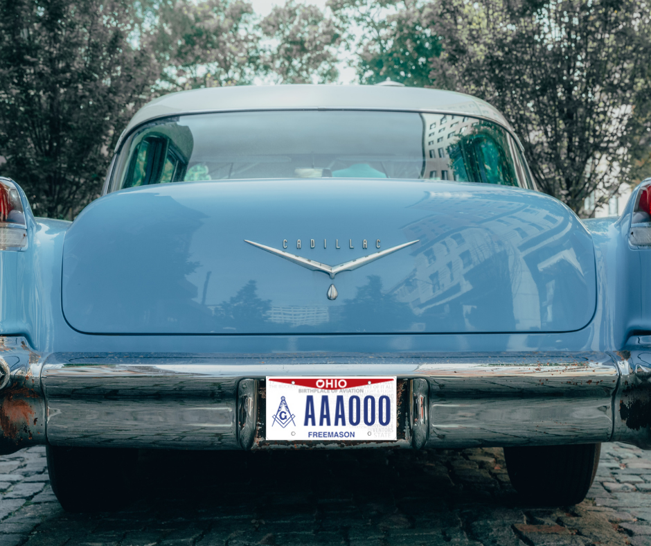 Ohio Freemasonry logo license plate on a blue Cadillac