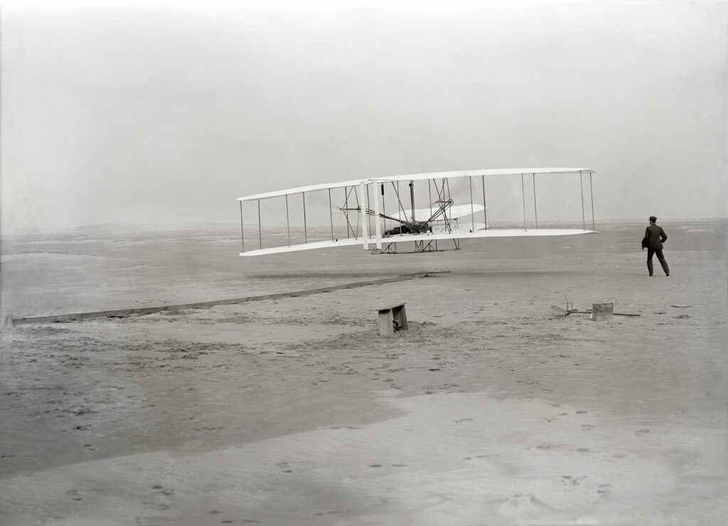A photograph of the Wright Brothers’ first flight