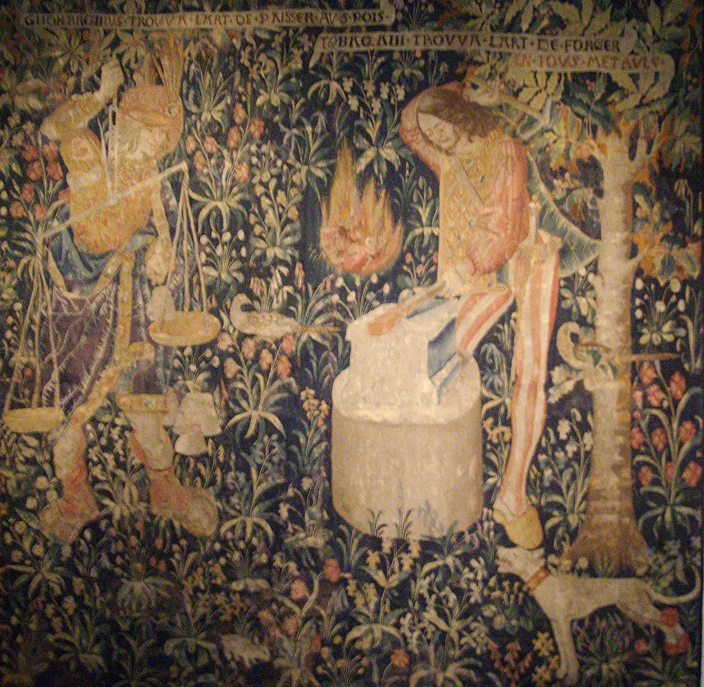 A photo of a tapestry depicting Tubal Cain working in his forge.