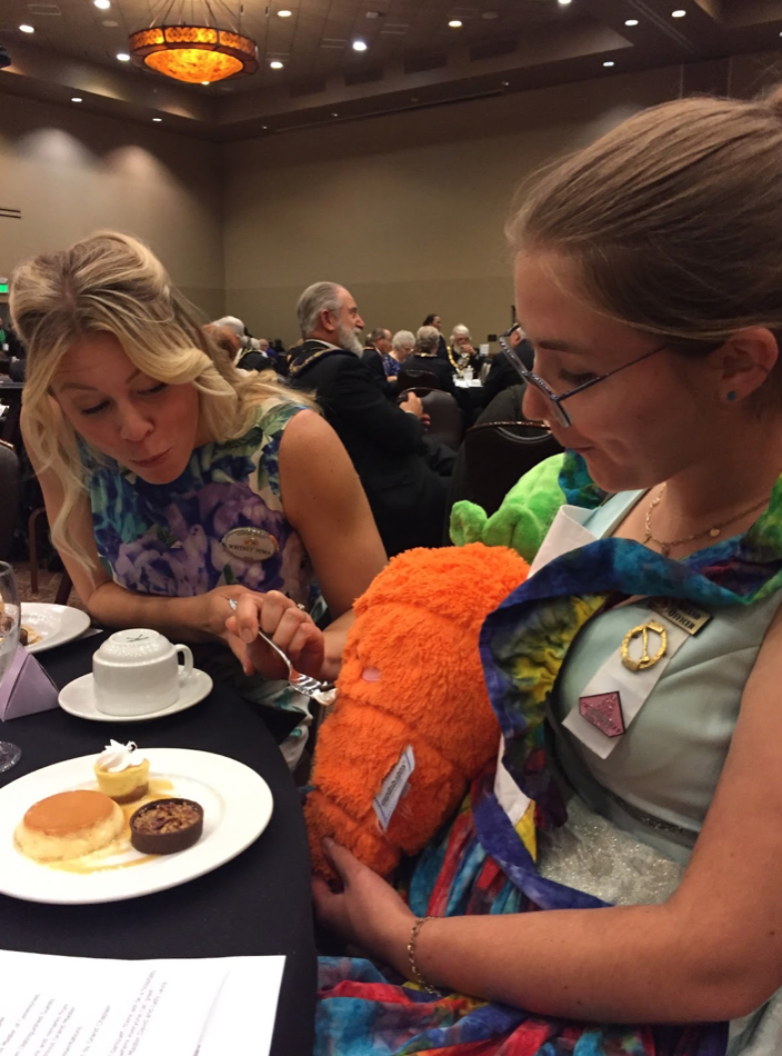 A photograph of two women at an event