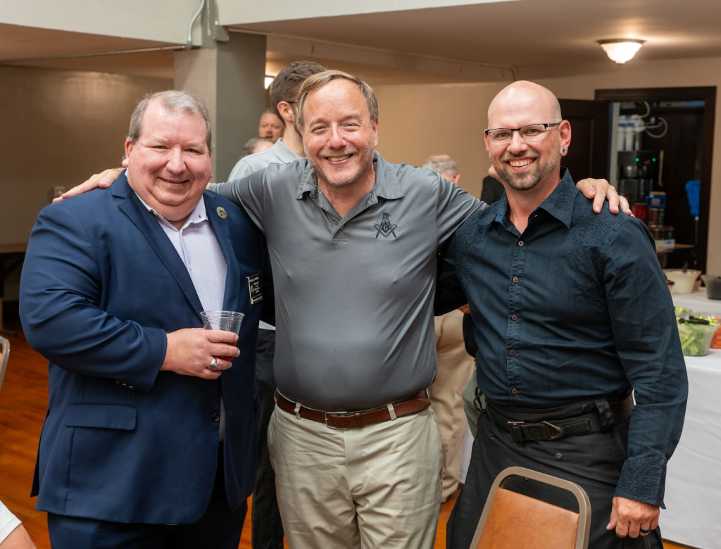 Three men smiling for a photo at Ohio's Masonic Weekend.