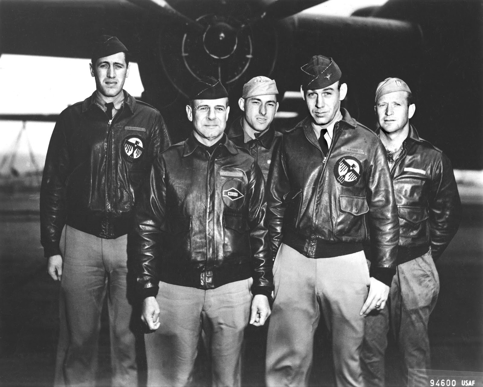 A photo of the Doolittle Tokyo Raiders posing in font of a fighter plane