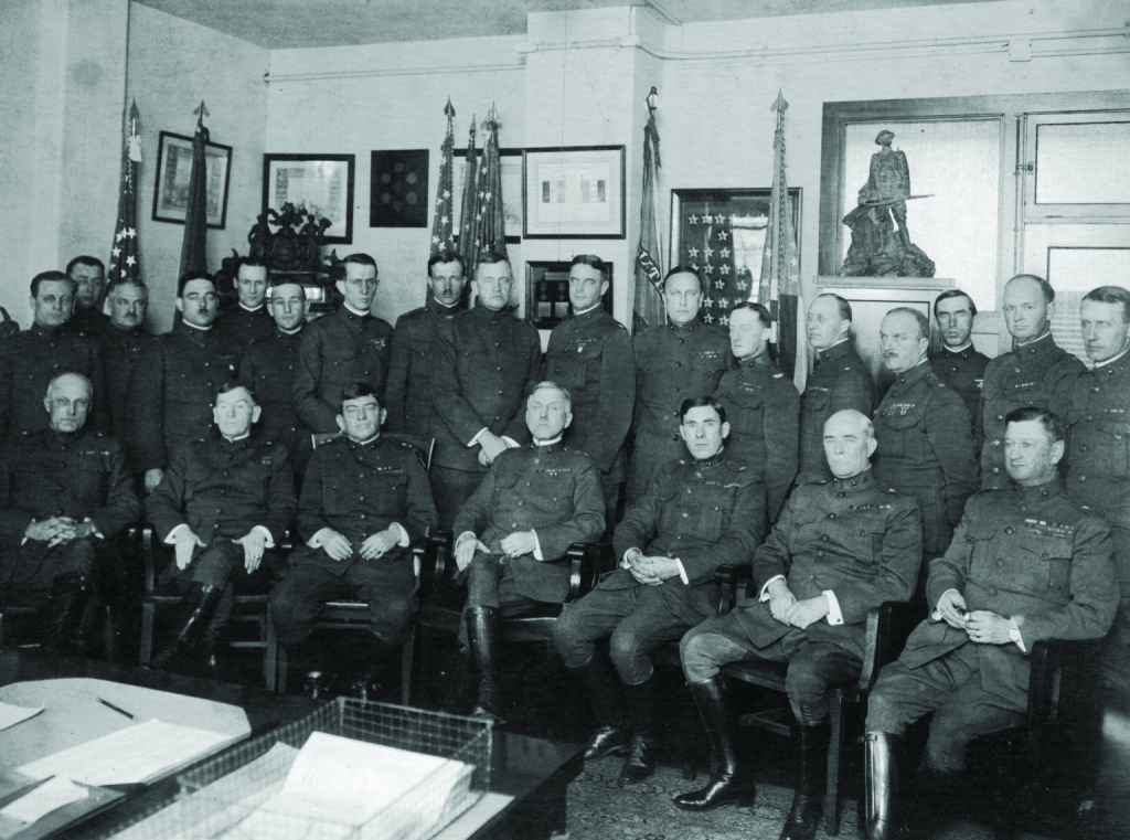 A black and white photo featuring John Lejeune and staff members at USMC offices in 1920.